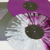 Colorful vinyl records with splatter patterns on Northlane Node half trans grape LP